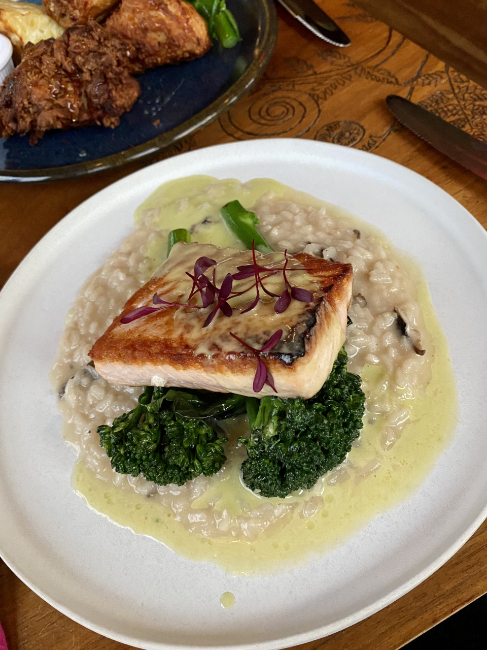 Close-up of a plate of salmon with brocolini and ramp butter