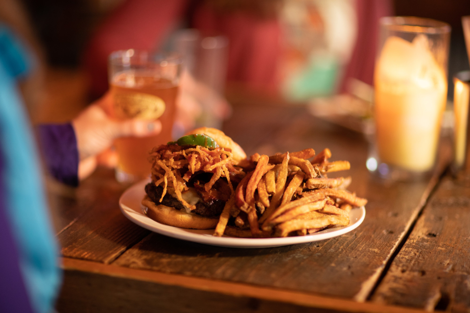 Drinks and a meal of burger and fries.