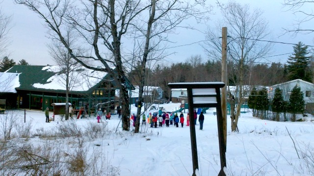 kids assemble for a cross country class, teaching the moves they will need once on skis