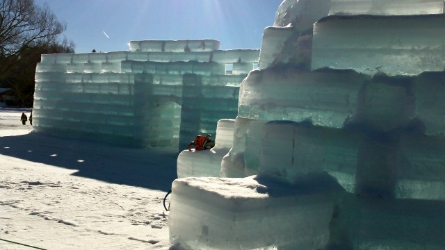 partially built Ice Palace rising from the lakeshore