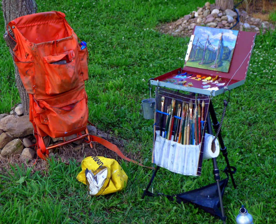 New materials mean our painting packs are easier to carry, but bushwhacking is still hard work! (Photo by Carol L. Douglas)