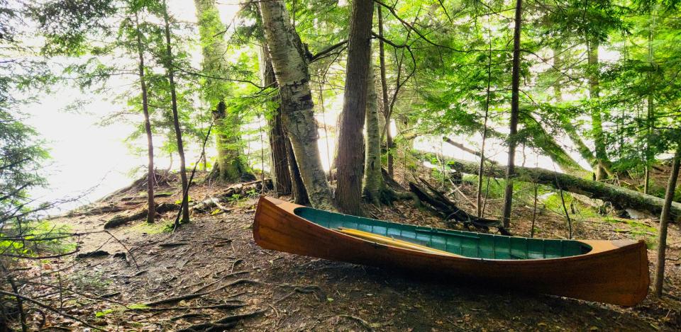 A guideboat by the water