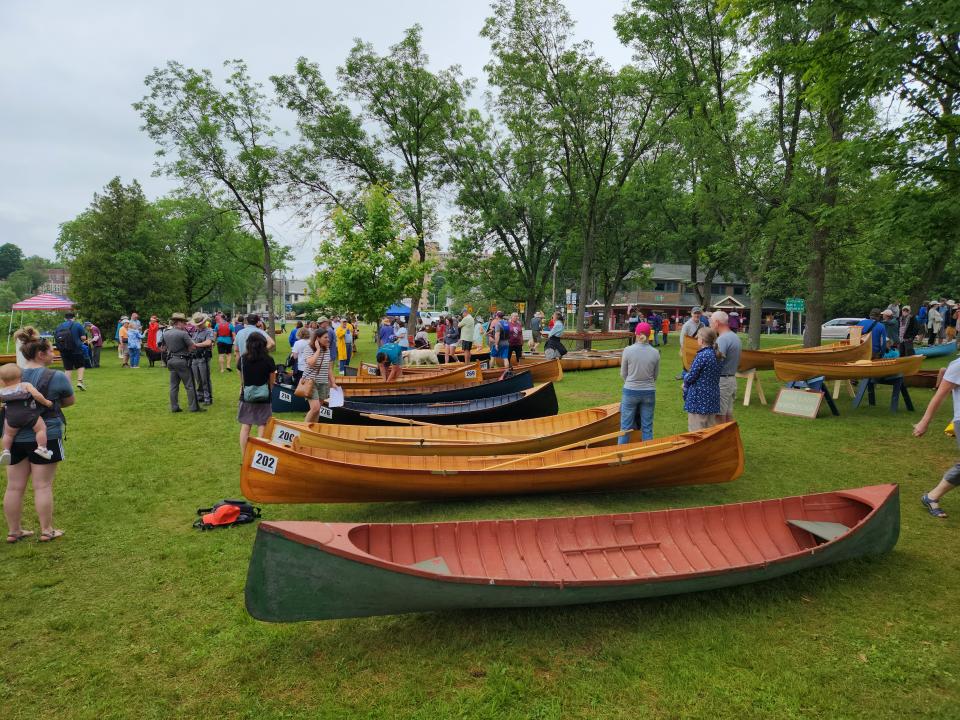 A bunch of guideboats displayed at an annual event