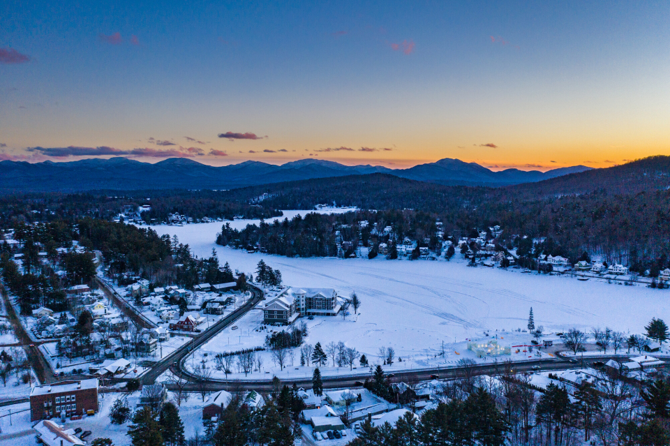 An aerial view of a mountain town in the winter