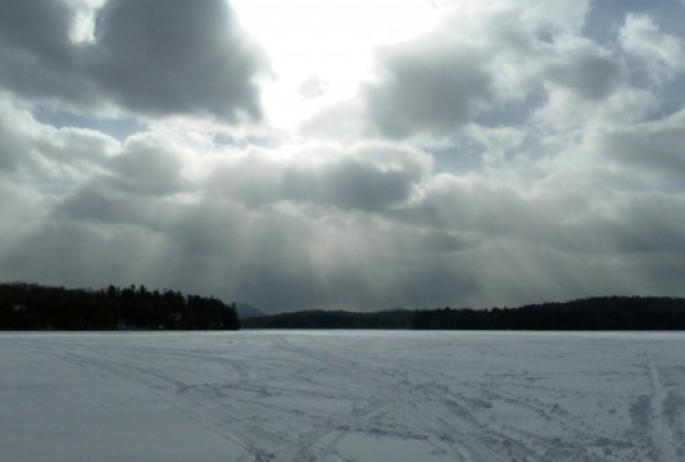 Sun coming out on Lake Colby