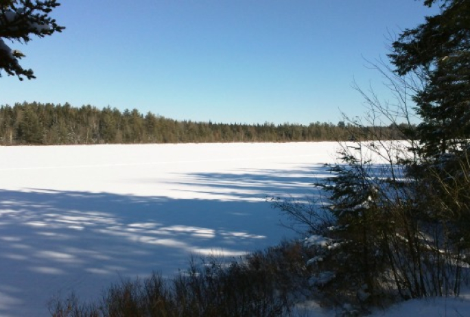 Lake Clear Outlet is the small pond adjoining, visible from the road.