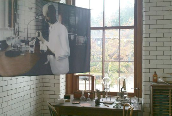 A photo of Dr. Trudeau is displayed in his actual laboratory, restored as a museum.