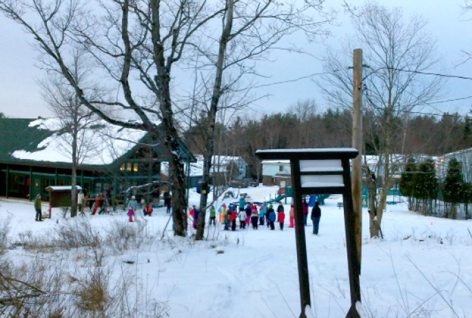 kids assemble for a cross country class, teaching the moves they will need once on skis