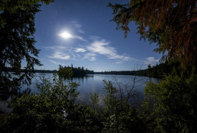 The moon rising over Follensby Clear Pond