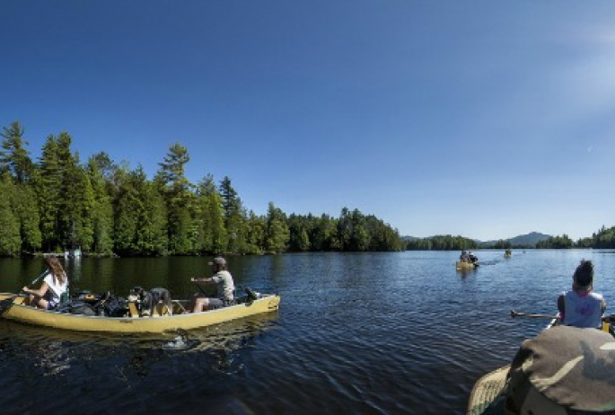 Canoeists paddle 90 miles from Old Forge in the Adirondack Canoe Classic - 90 Miler Race.