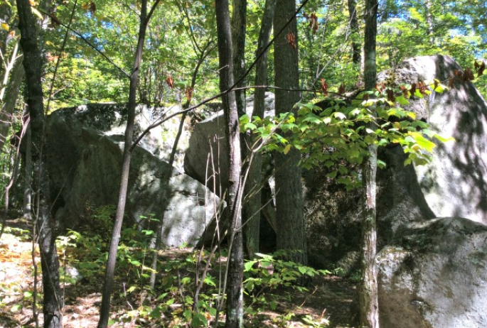 While some of the boulders are the size of a mountain cabin, this cluster is more like a classic Great Camp, with many separate buildings.