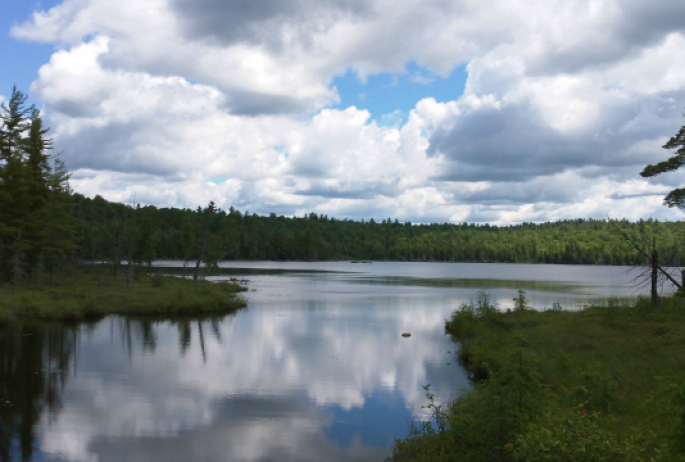 a brake-worthy sight -- the clouds reflected in McCauley Pond