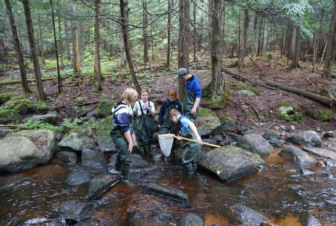 Lake Placid Middle School students explore along Barnum Brook.