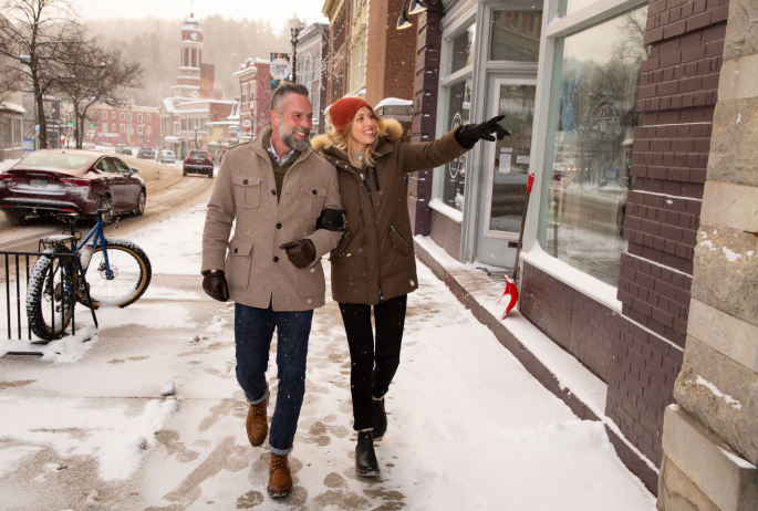 A man and woman shop for the holidays.