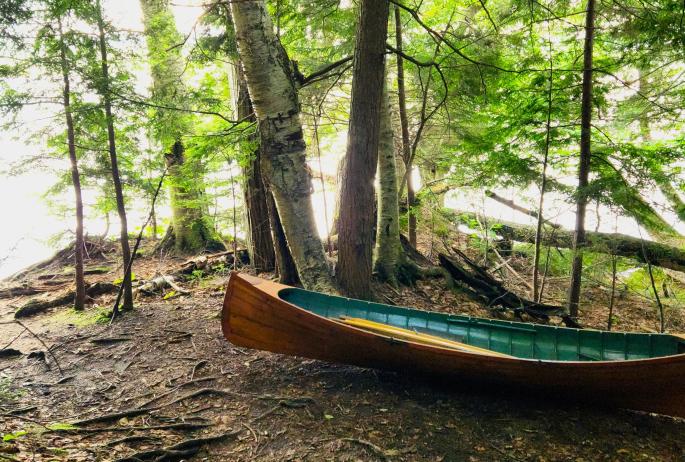 A guideboat by the water