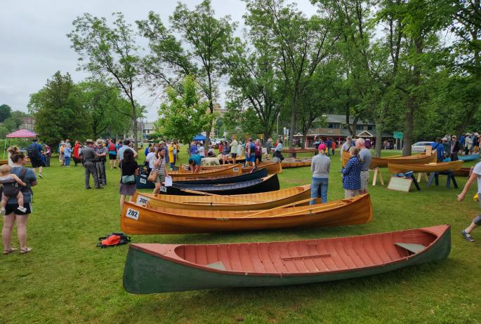 A bunch of guideboats displayed at an annual event