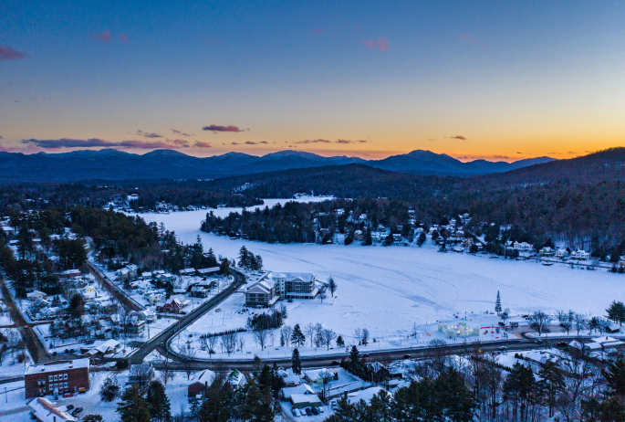 An aerial view of a mountain town in the winter