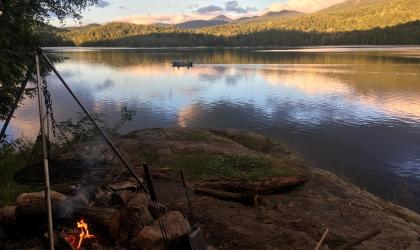 A campfire by the water