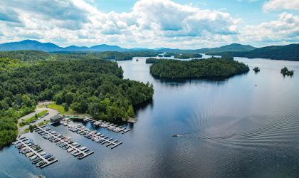 drone view of marina and lower saranac lake in the adirondack mountains