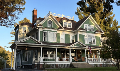Exterior of the Franklin Manor with elaborate white trim